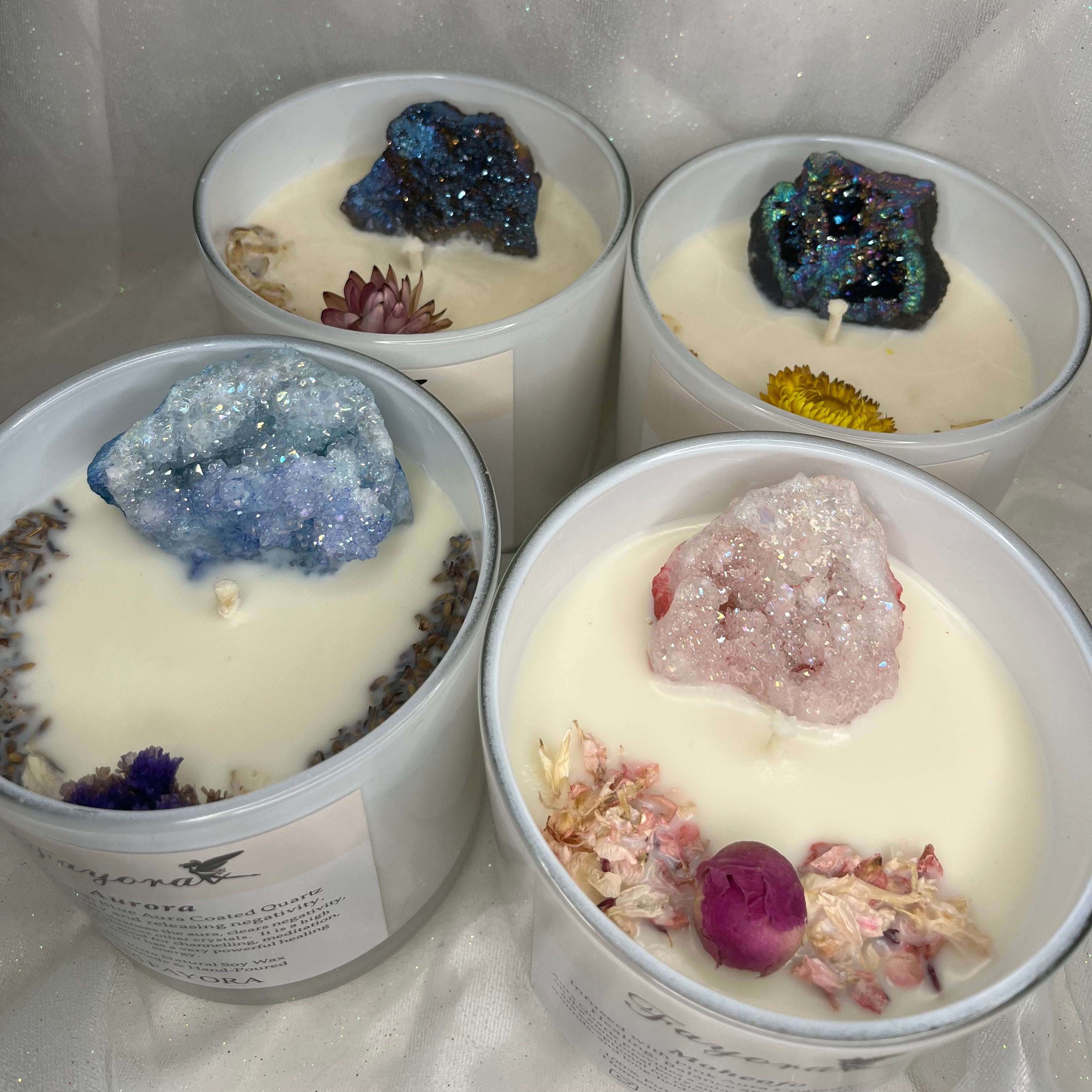 Back Left: Siren Candle Back Right: Callisto Candle Front Left: Moheofo Candle Front Right: Aurora Candle